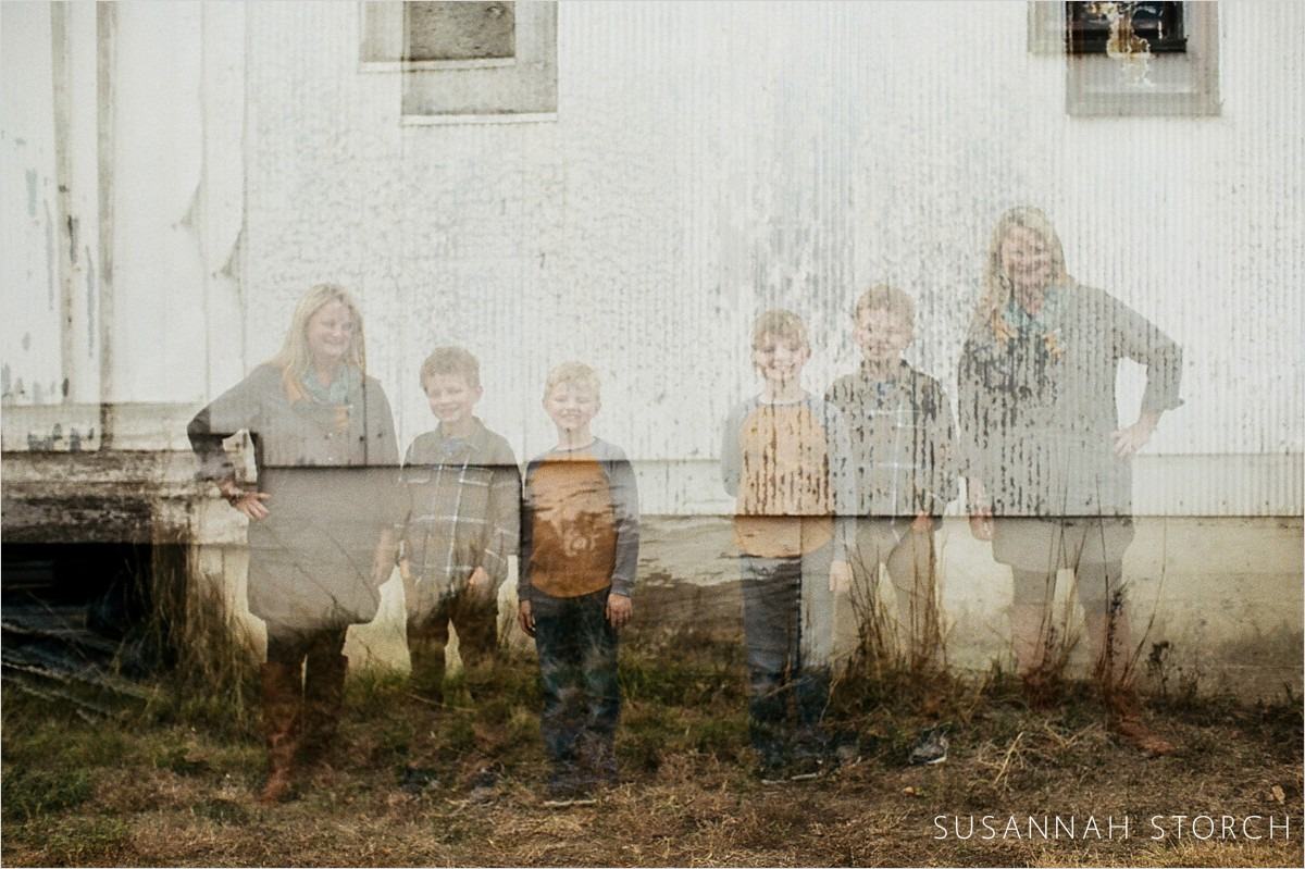 double exposure of a mom and her sons on a white wall