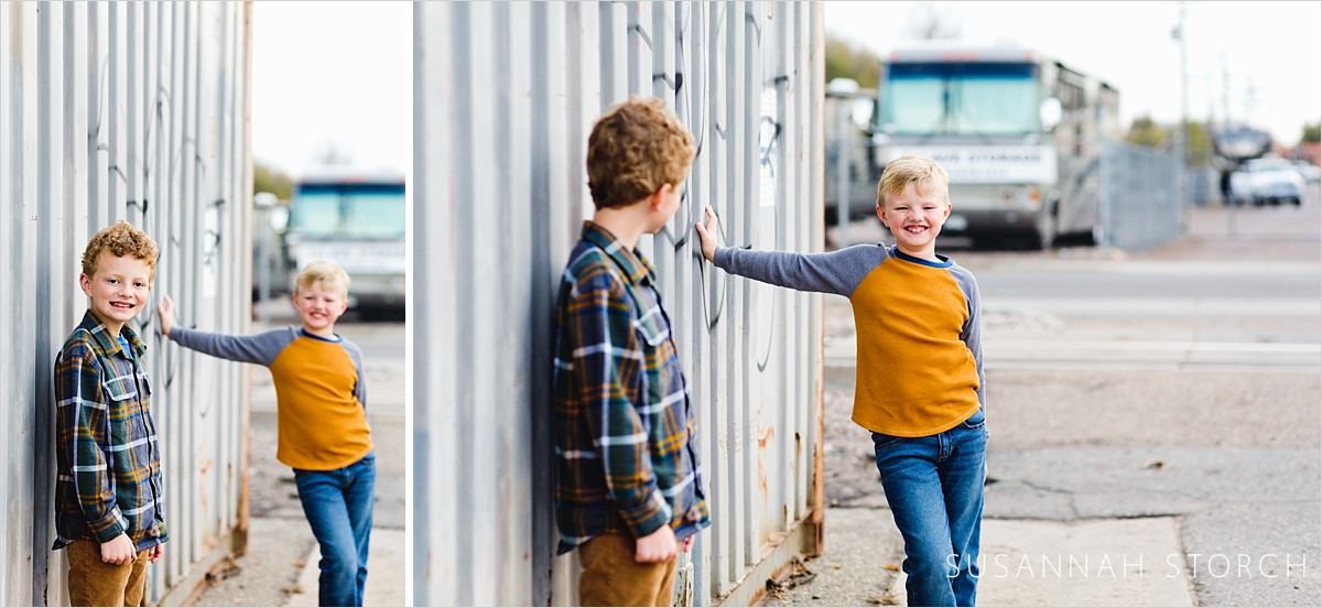 images of brothers standing in front of shipping containers