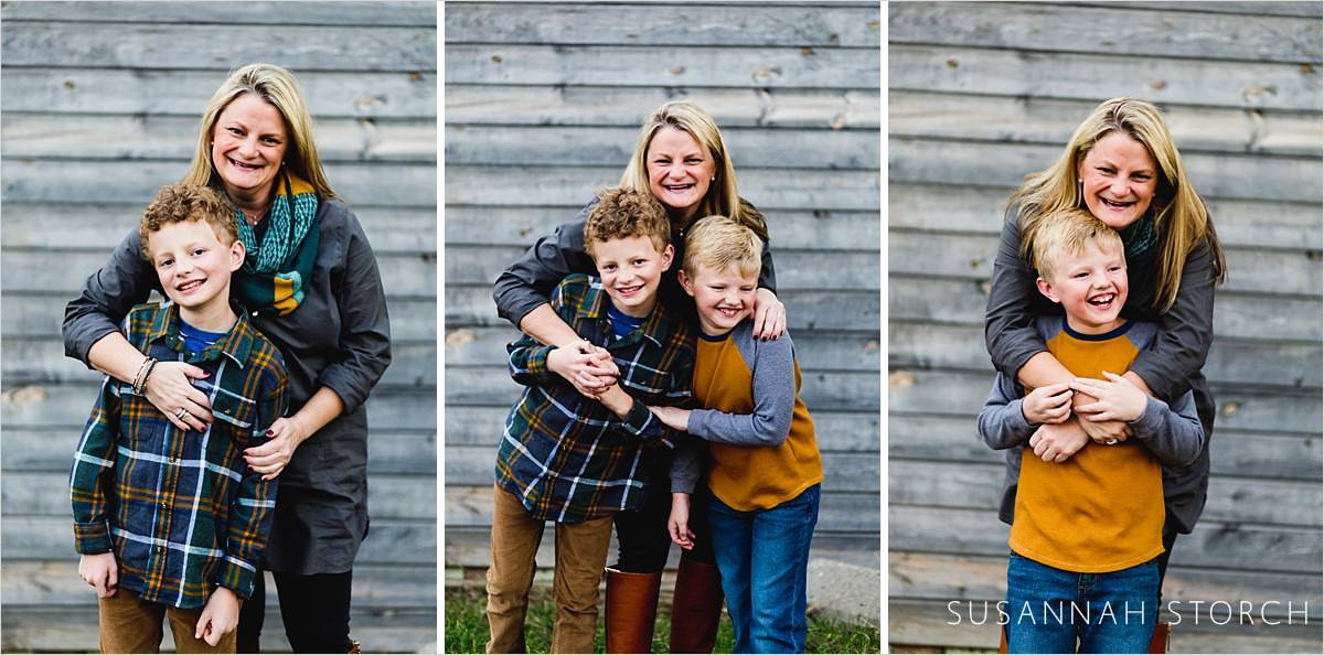 images of a mom and her sons in front of a nice wood wall