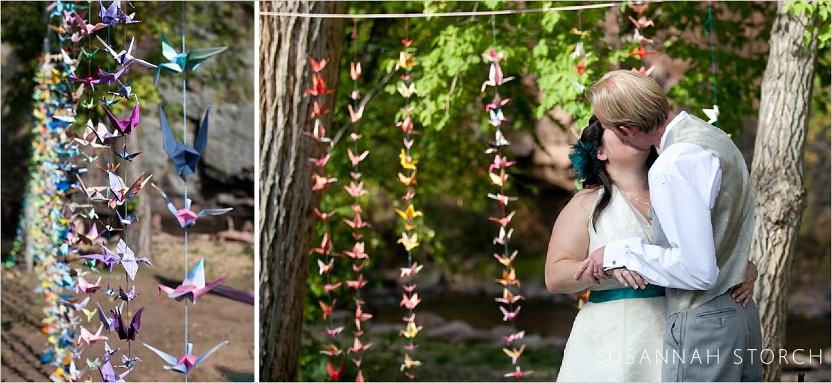 two images of a wedding couple standing near paper cranes