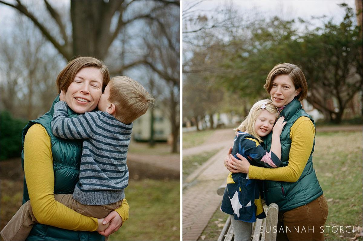 a mom plays with and her holds her kids