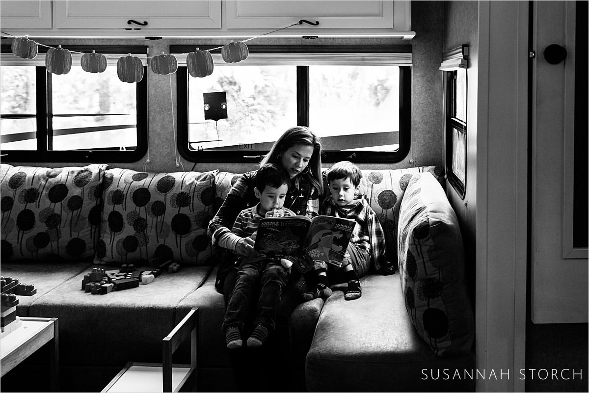 mom reads a book to her son