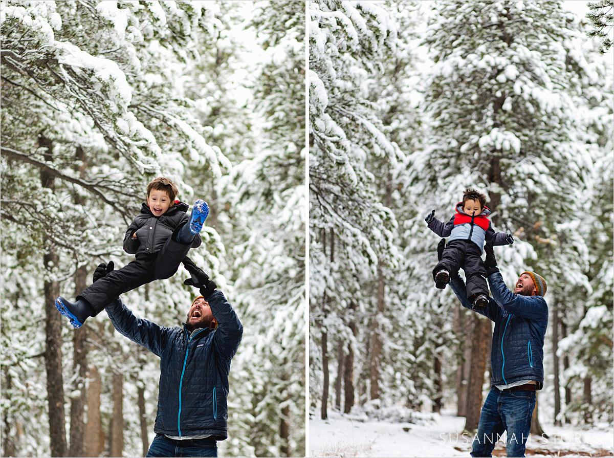 dad throws young sons in the air