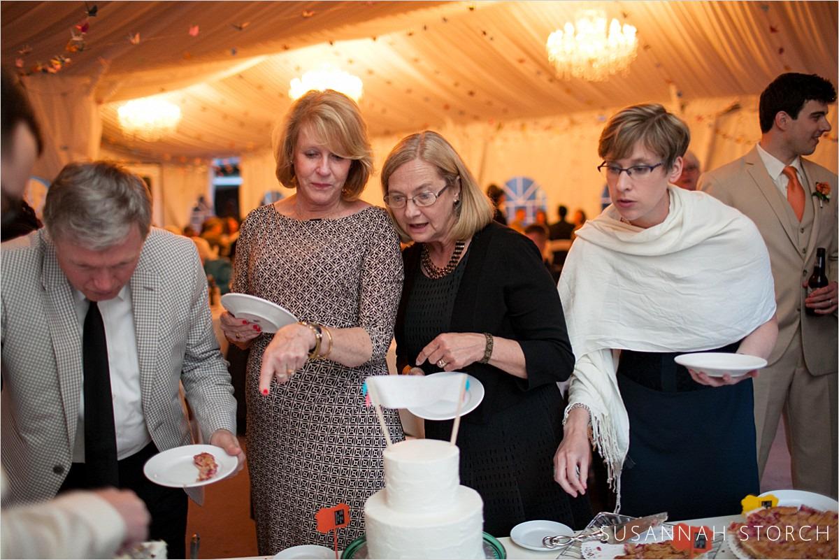 women look at a dessert table during a Boulder wedding reception