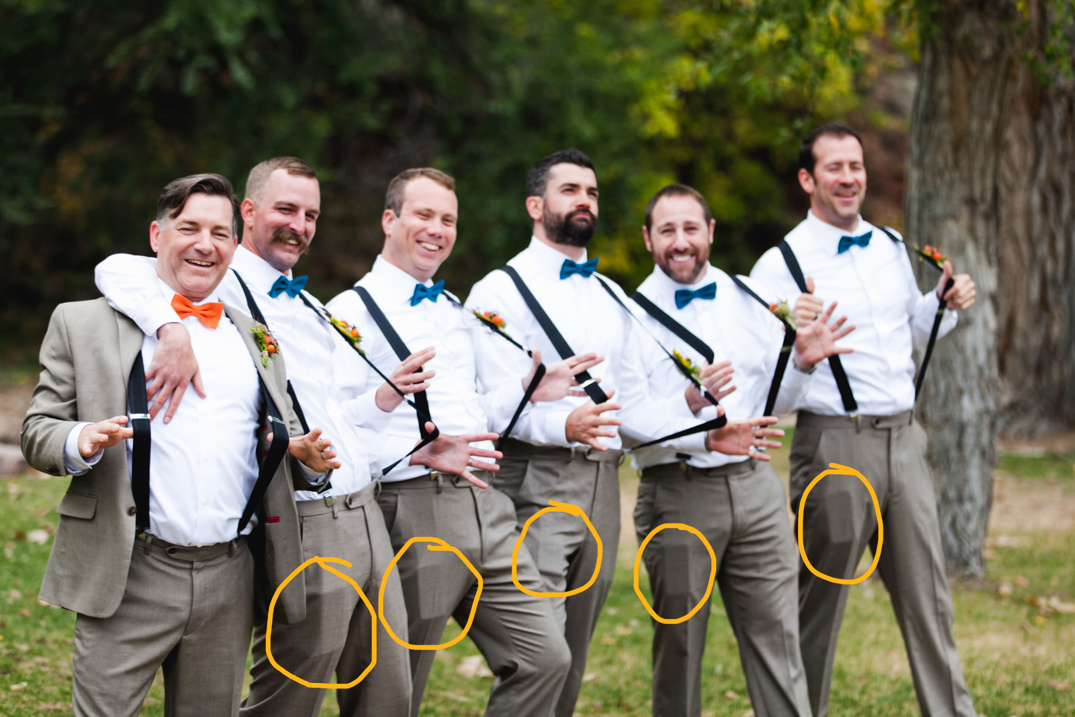 groomsmen with cell phones in pockets