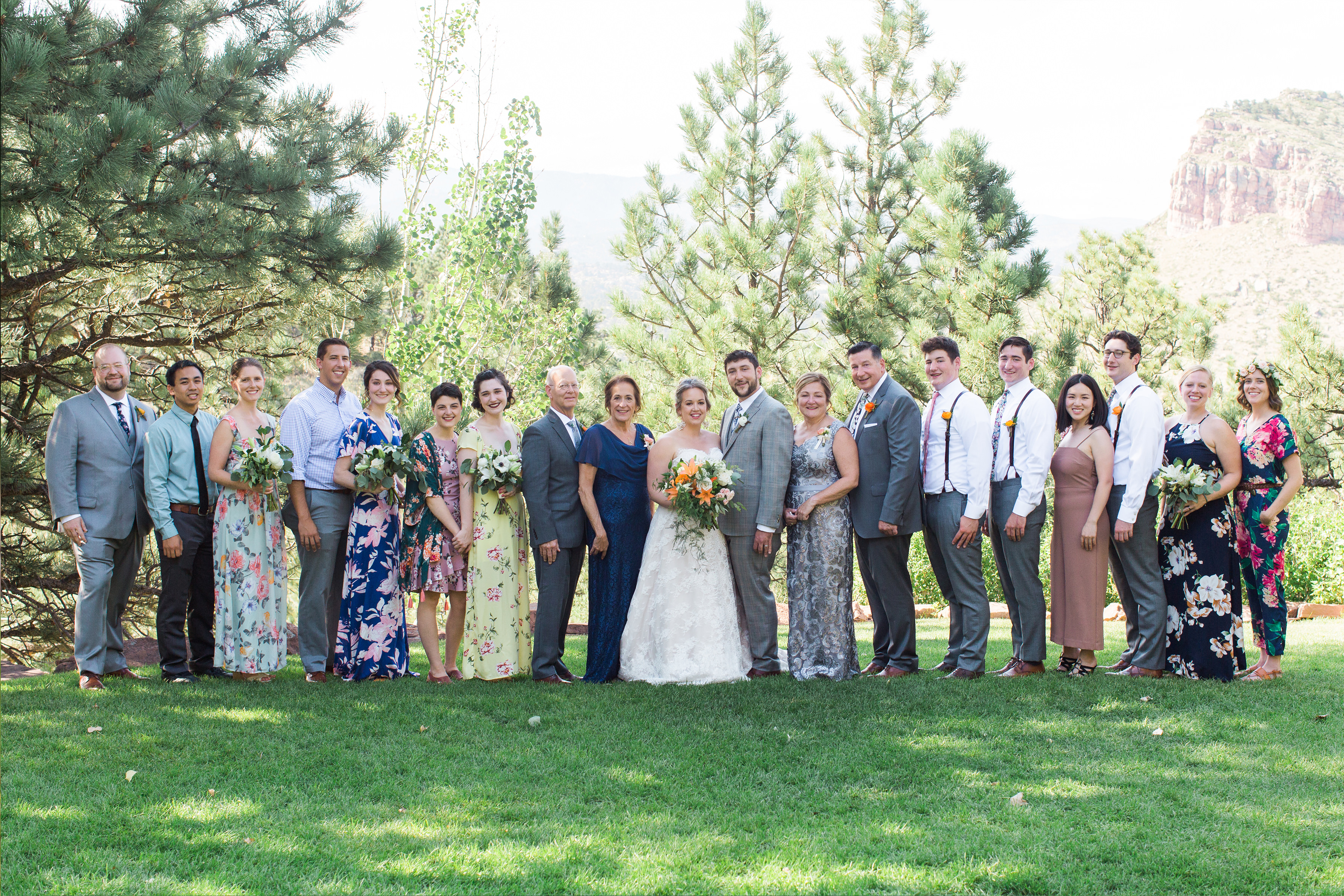 family and loved ones pose for a family wedding photos