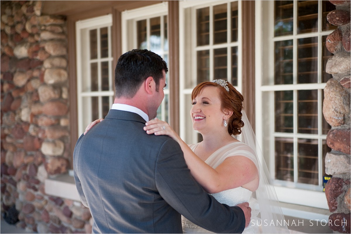 a wedding couple look at each other for the first time on their day