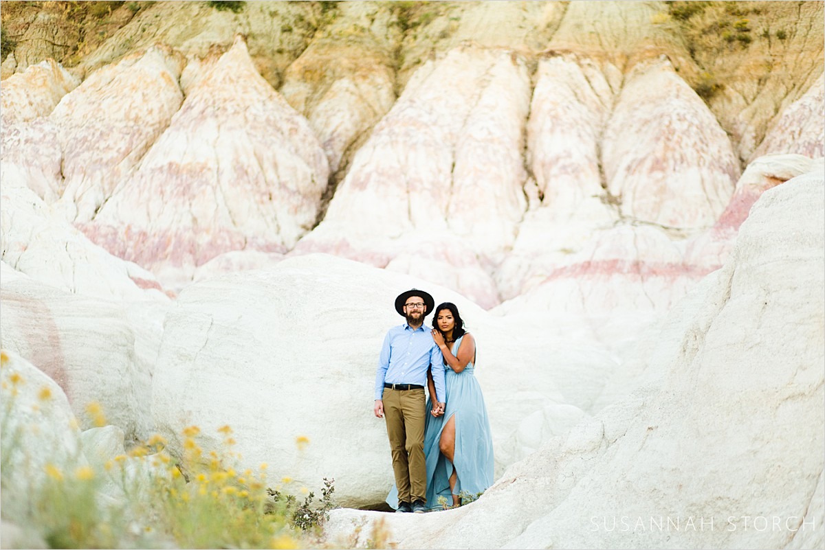 engaged couple pose at the paint mine rock formations east of colorado springs