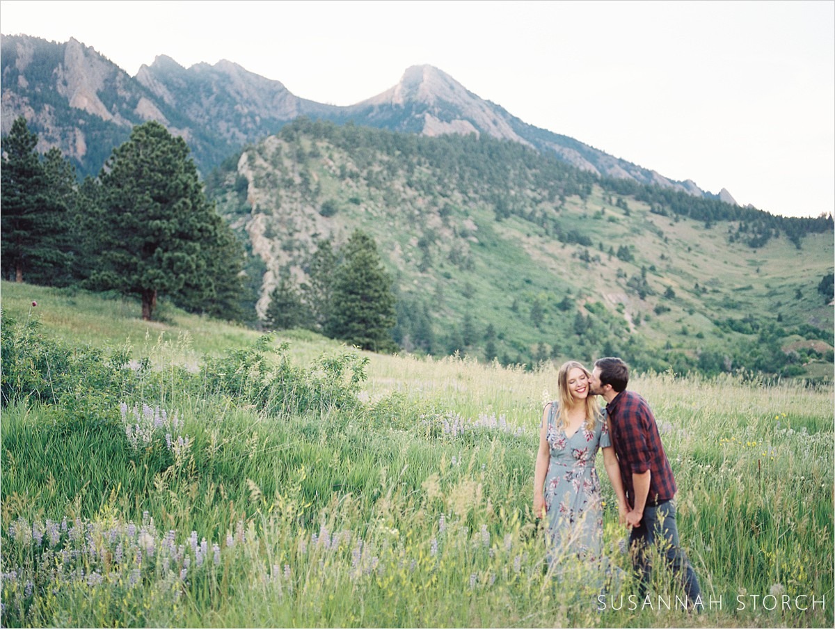 a couple kiss in the foothills