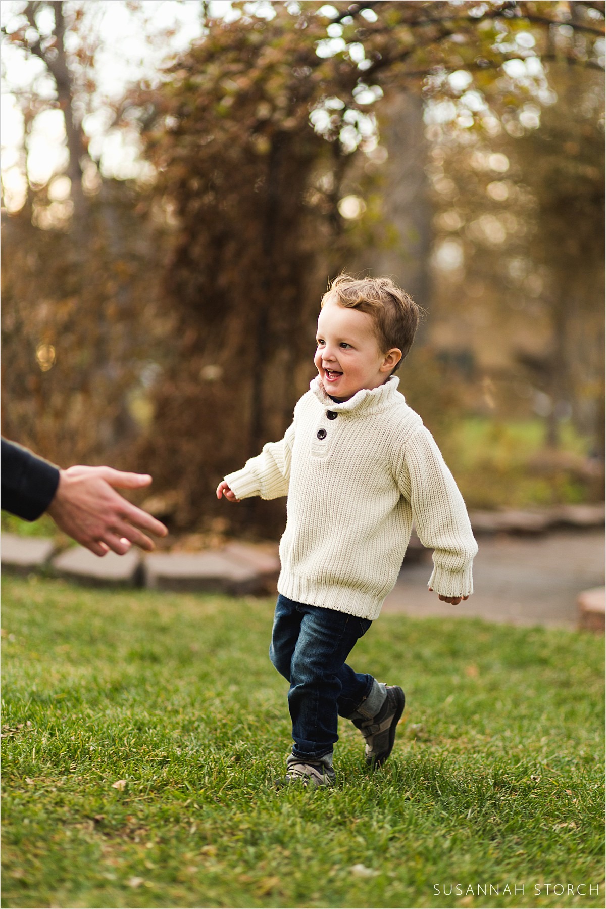 toddler outdoor photoshoot with running young boy