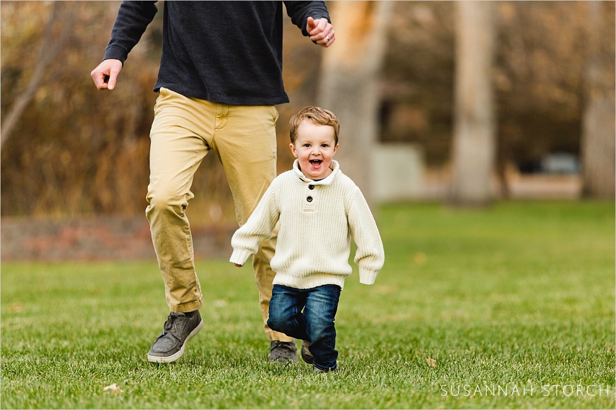 running toddler boy during an outdoor photoshoot