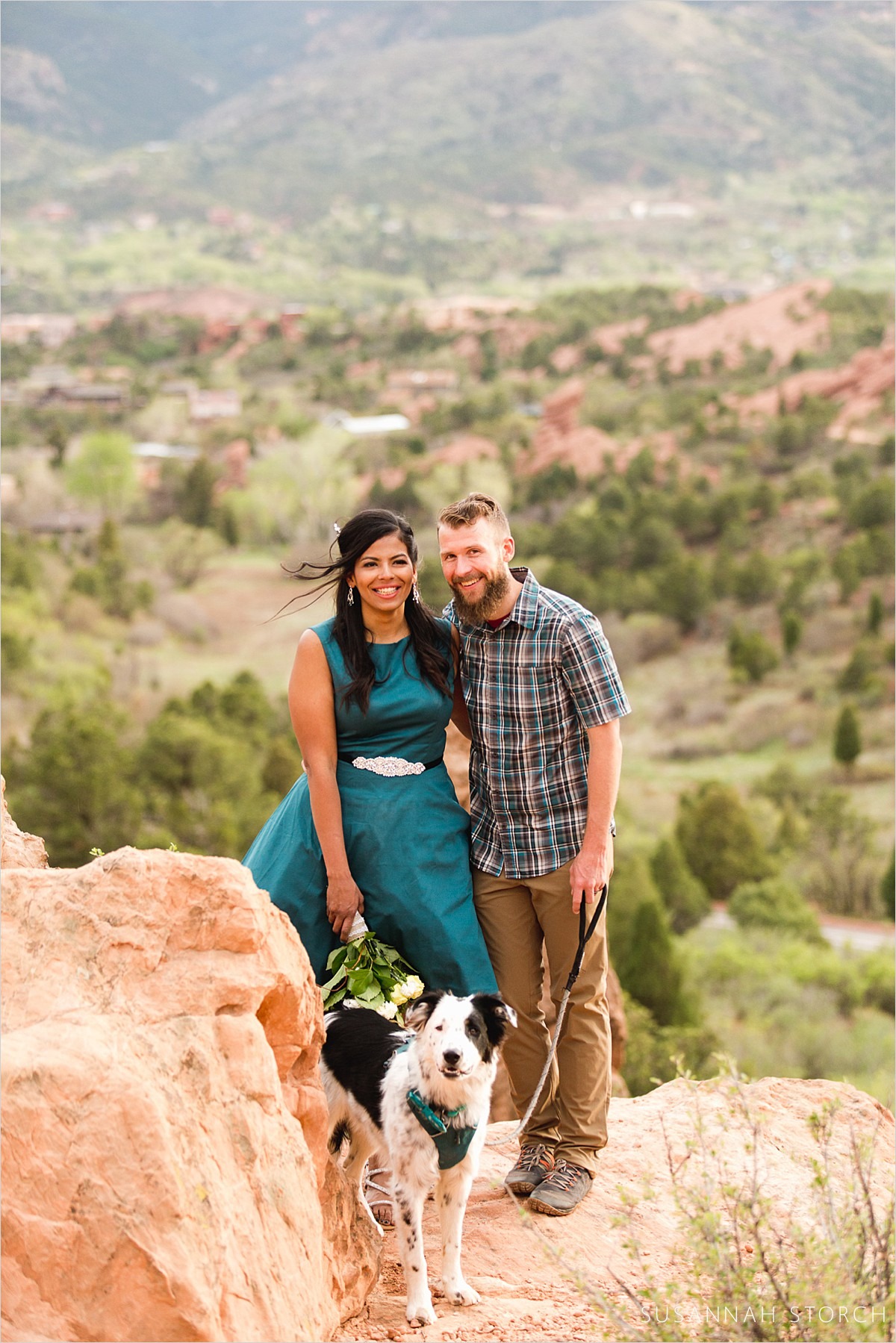 a couple and their dog pose after eloping