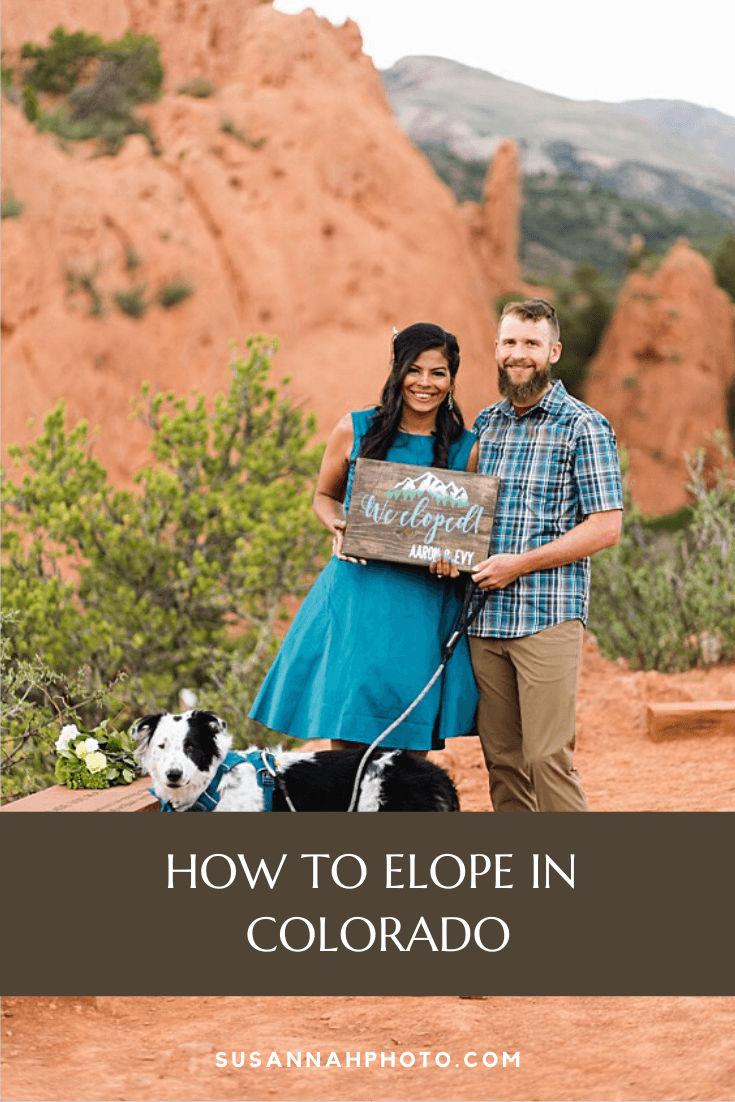 couple hold a "just eloped" sign in garden of the gods