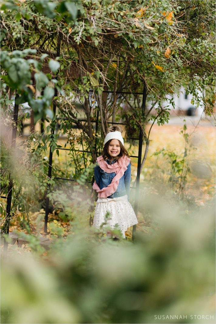 portrait of a girl by an arch
