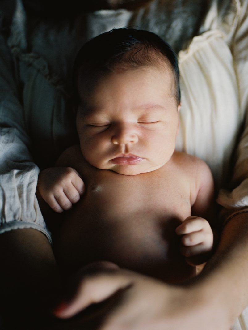 baby girl sleeps on mama