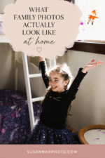 Young girl smiling and playing in her bedroom during an in-home family photo session.