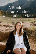 Smiling CU Boulder graduate in a black graduation gown and white stole seated outdoors with the Flatirons behind her.