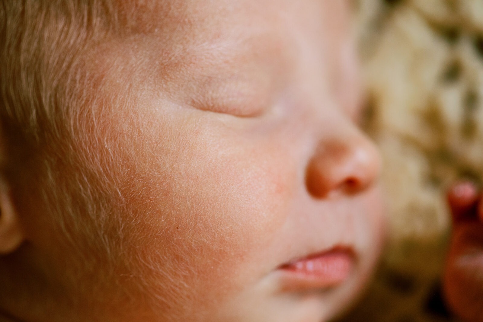 close up of a newborn baby's cheek during a luxury in-home newborn session