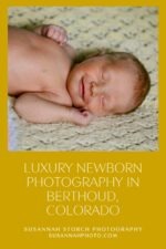 A baby smiles slightly while she naps on a handmade blanket during a luxury newborn photography session in Colorado