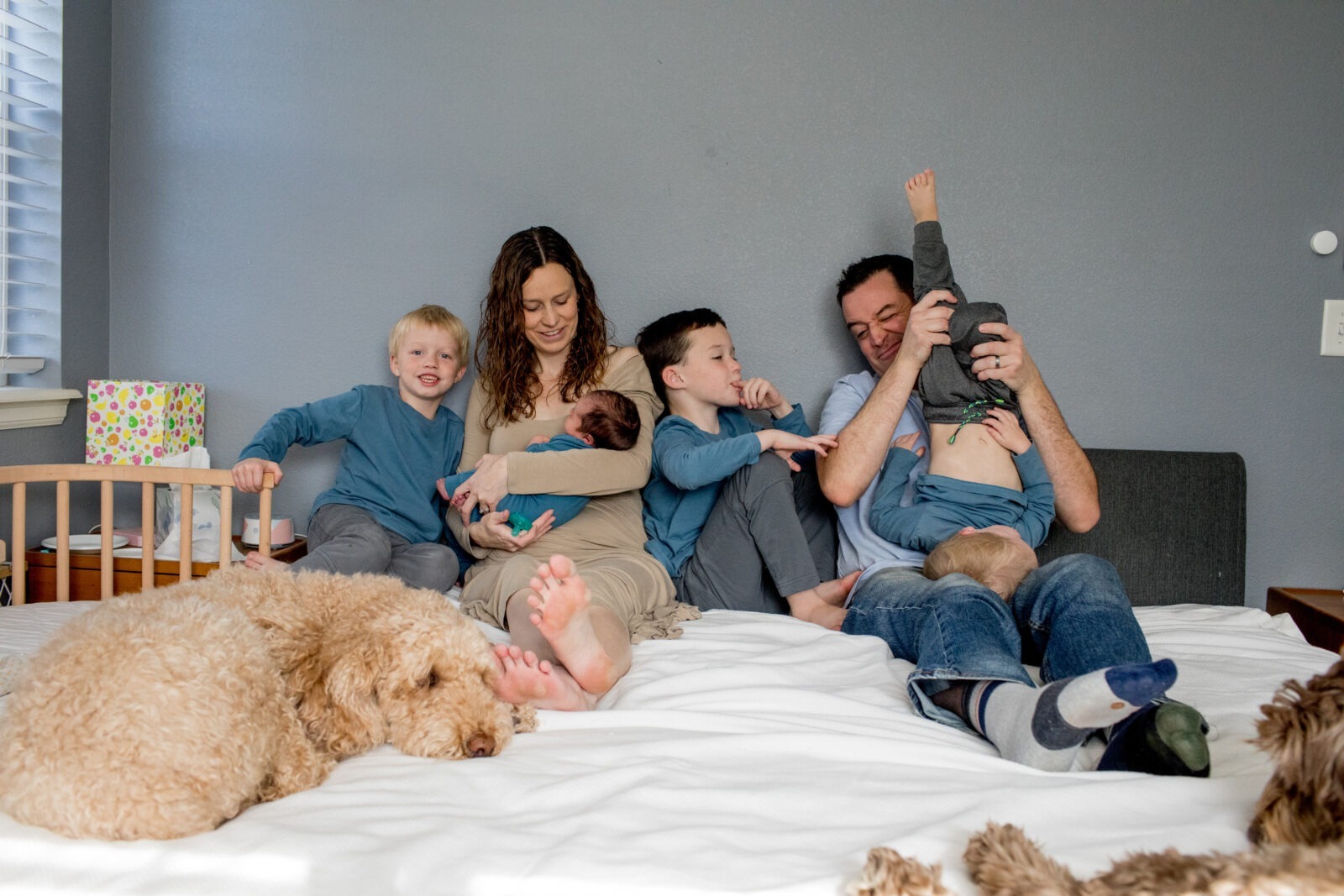 in-home newborn photography session with many boys