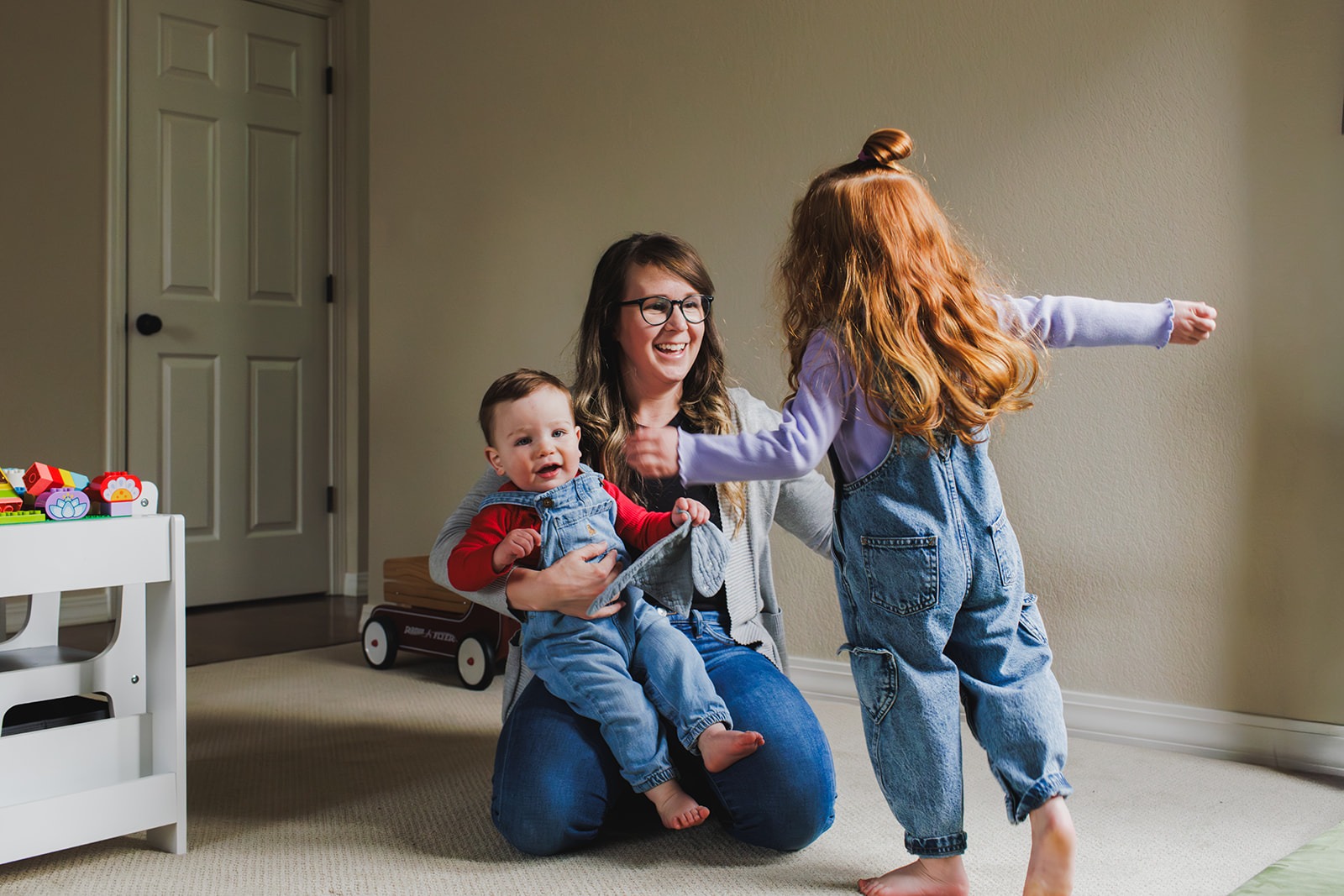 mother and daughter interacting during in-home family photography session