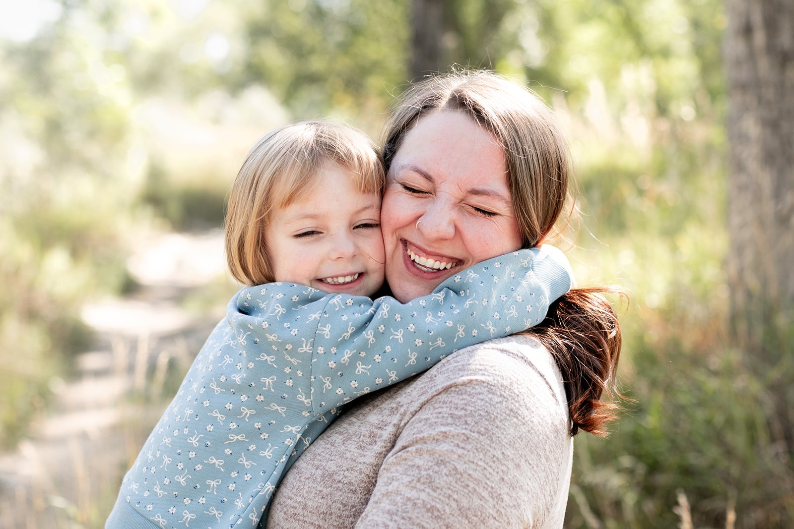 smiling mom and daughter during a spring mini session in Berthoud, CO