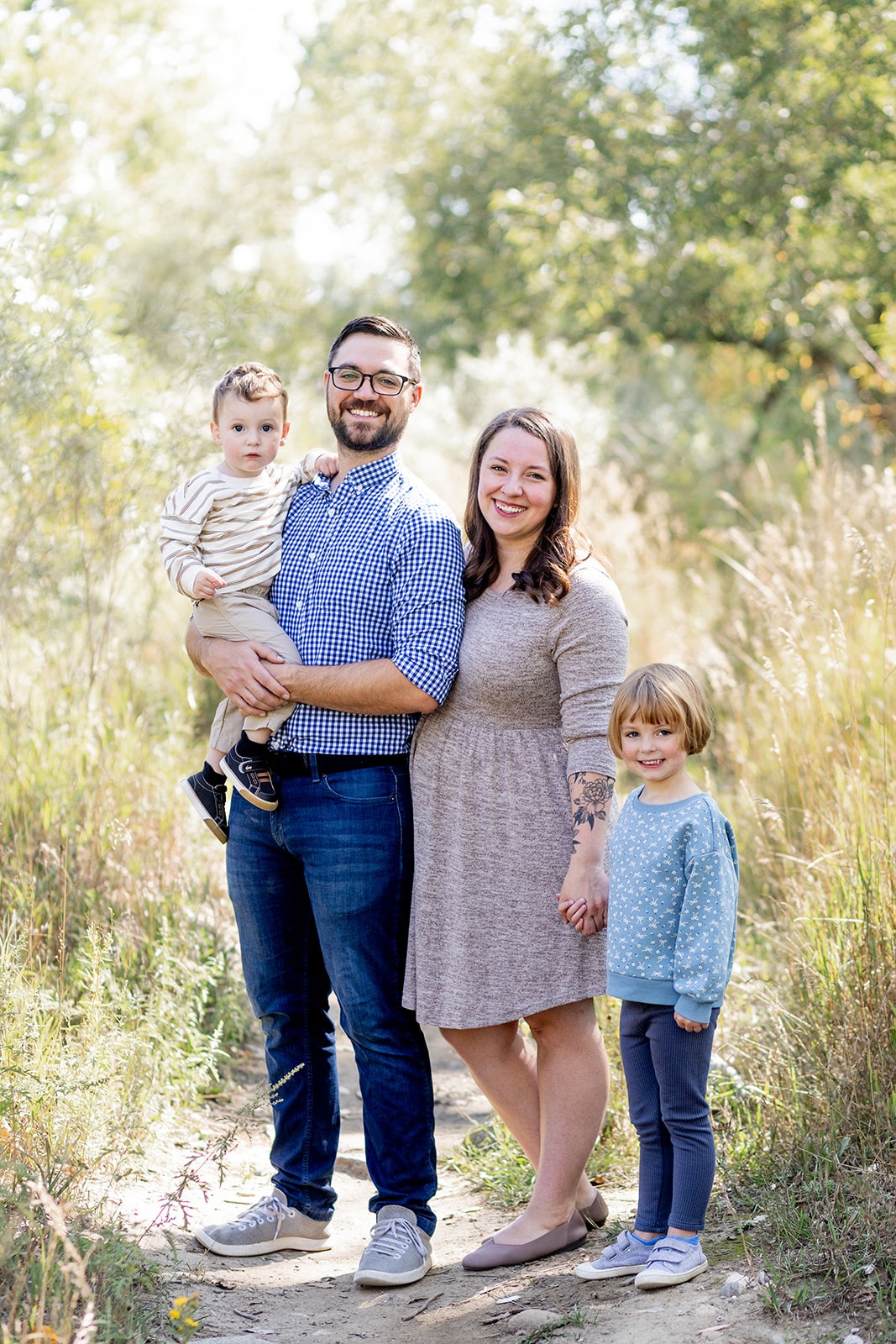 family posing together during spring mini session in Longmont Colorado
