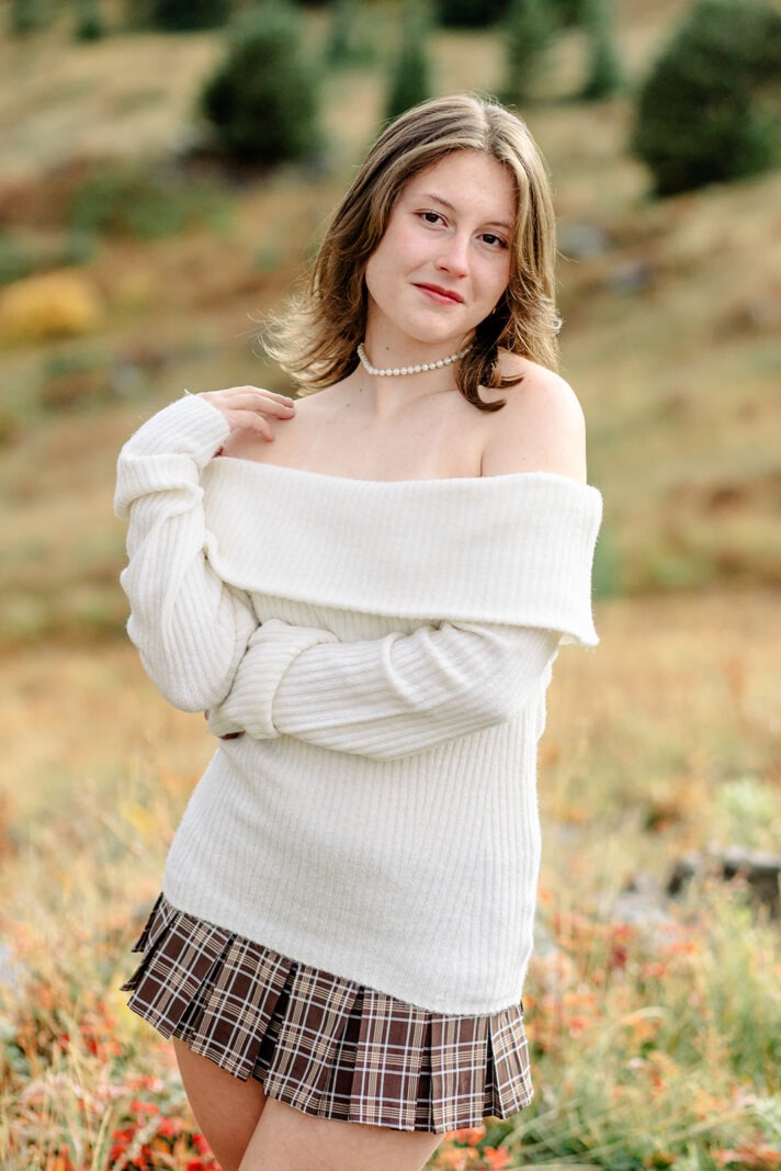 niwot high school senior poses during her colorado senior photo session on a fall day in the mountains