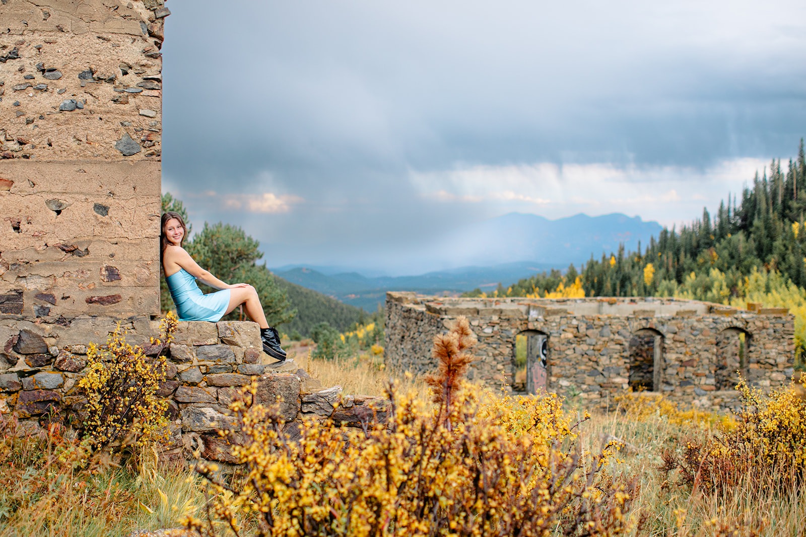niwot high senior girl poses for photos in mountains outside of nederland in fall