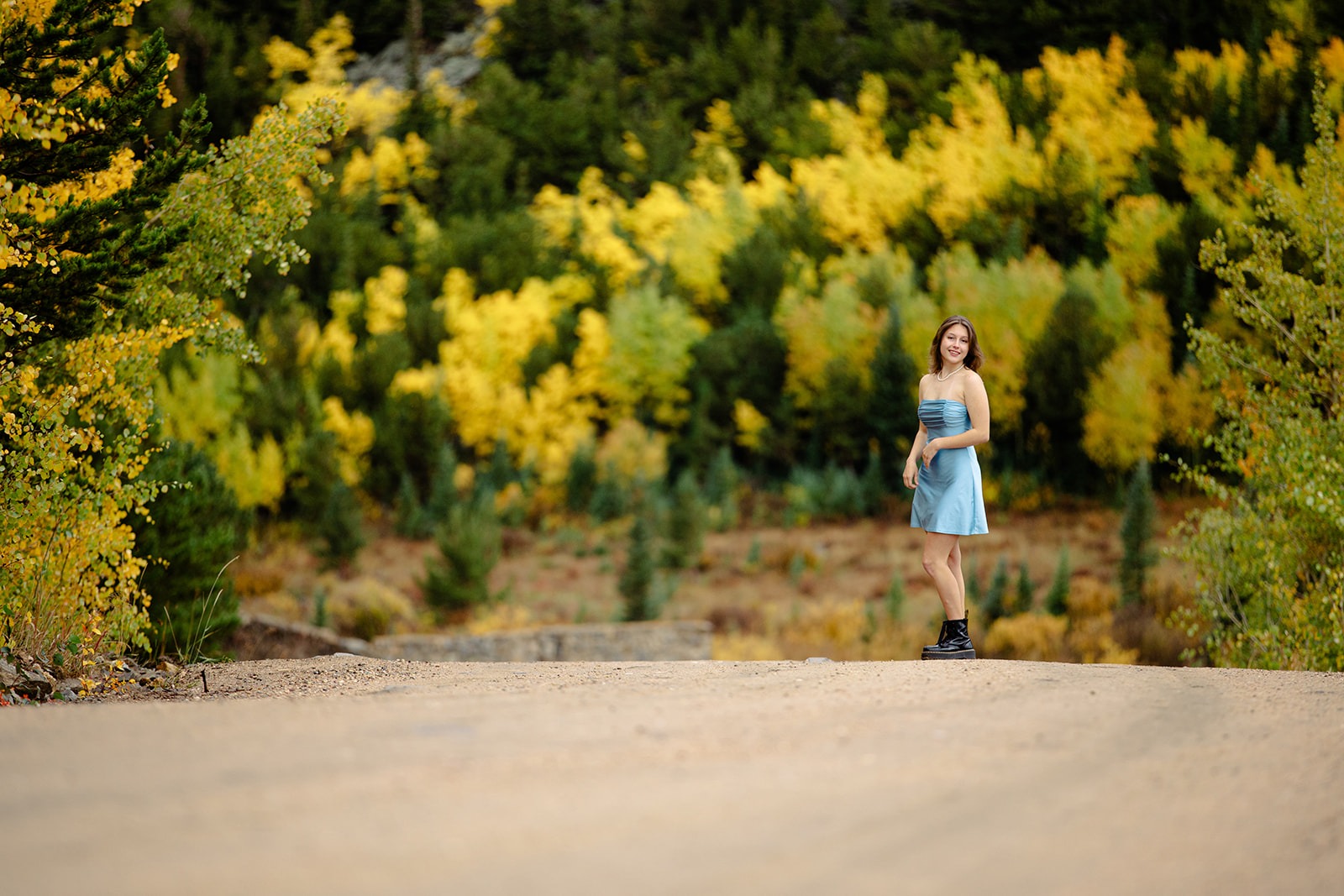 niwot high school senior poses during her colorado senior photo session on a fall day in the mountains