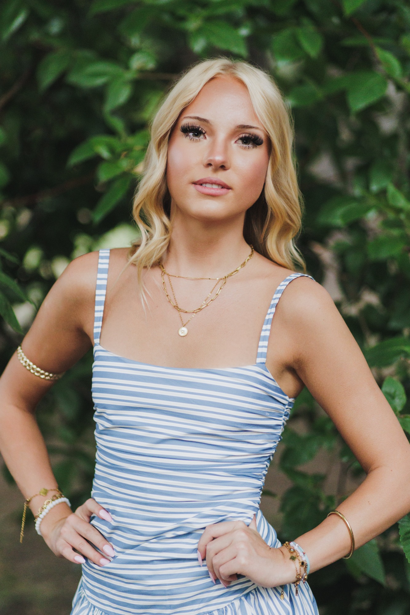 Teen poses with hands on hips during boulder senior photography sesion