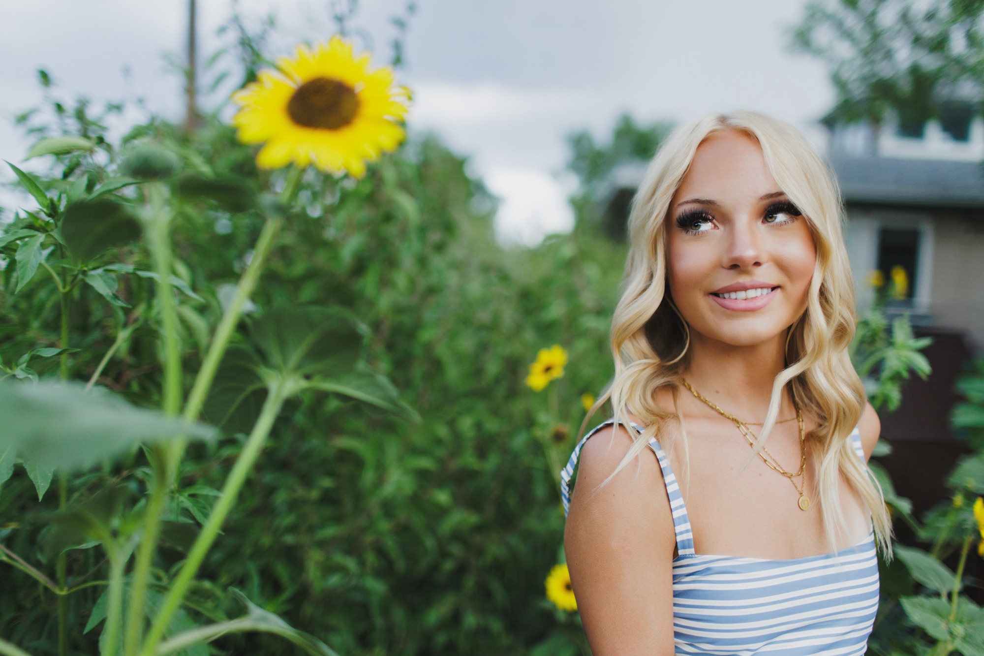 Boulder senior photo session featuring senior and sunflowers